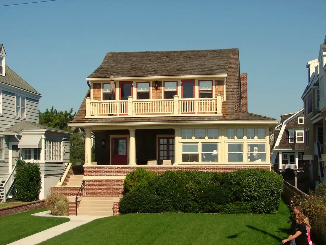 A family home with a lawn and garden, the kind of property covered under personal insurance